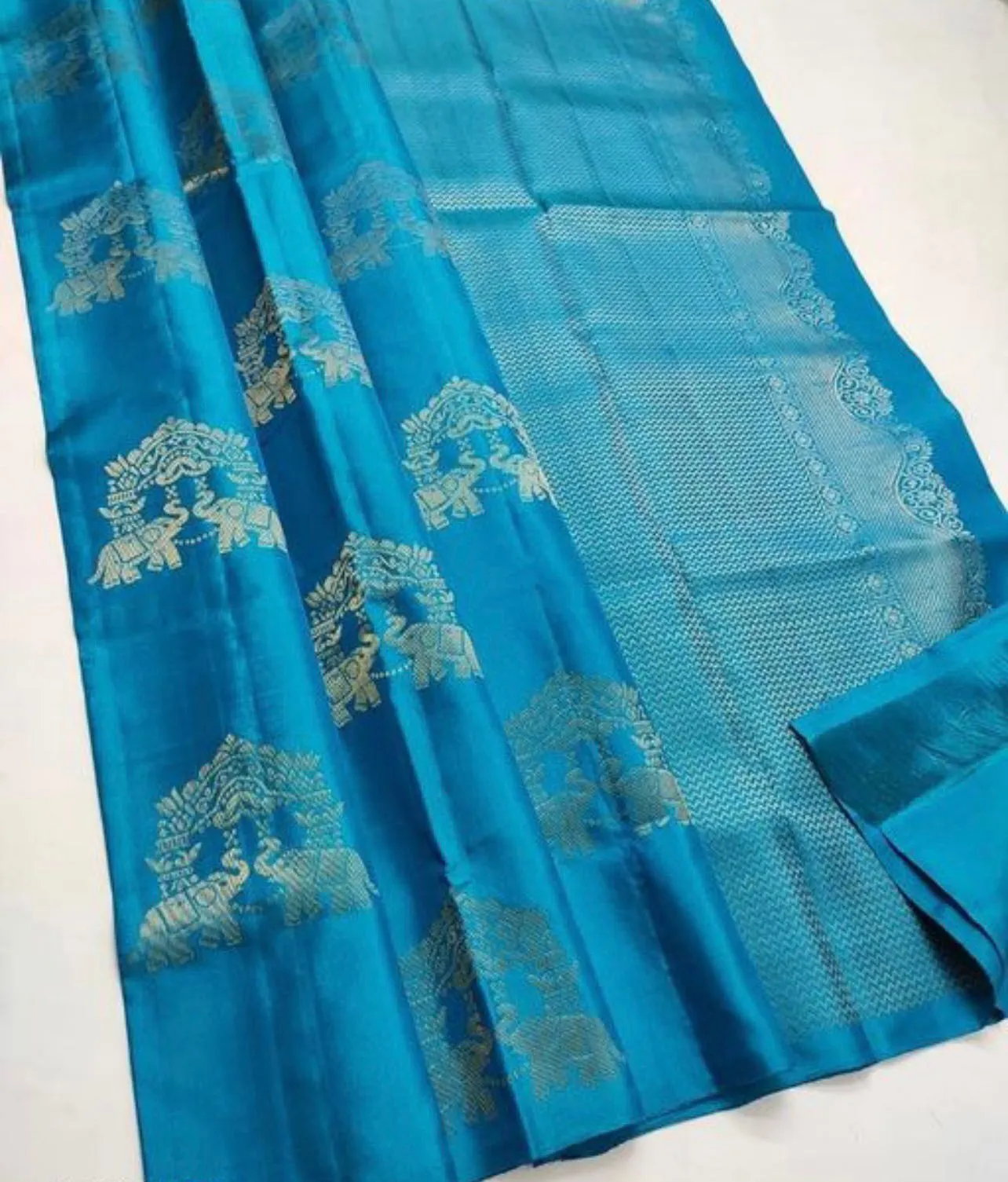 Sumptuous Turquoise Soft Silk Saree With Palimpsest Blouse Piece